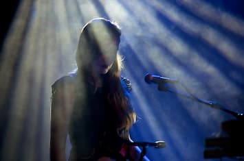 A Woman Sings at a Trip Hop Concert